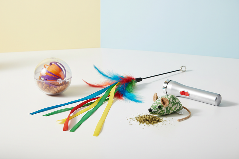 cat toys on a white countertop surface