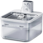 Pet water fountain with water flowing on a white background