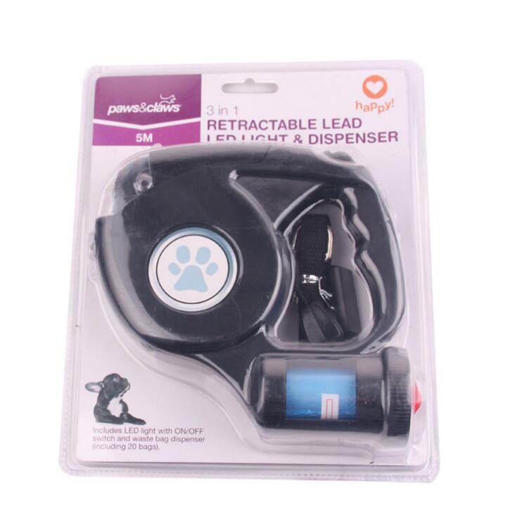 Packaged 3-in-1 retractable dog lead, LED light, and dispenser with 'Paws & Claws' branding.