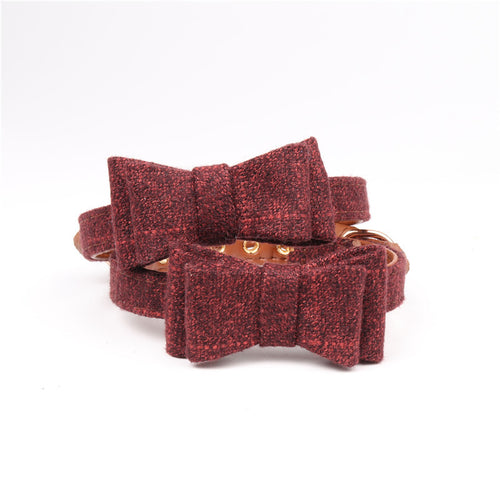 Red textured jewelry box with a gold ring on a white background