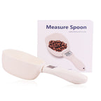 White measuring spoon with coffee beans and a white box labeled 'Measure Spoon' on a white background.