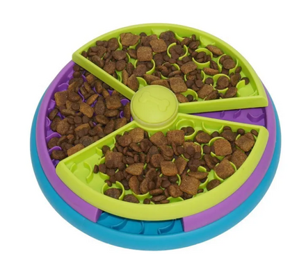 Colorful pet toy with food compartments on a white background