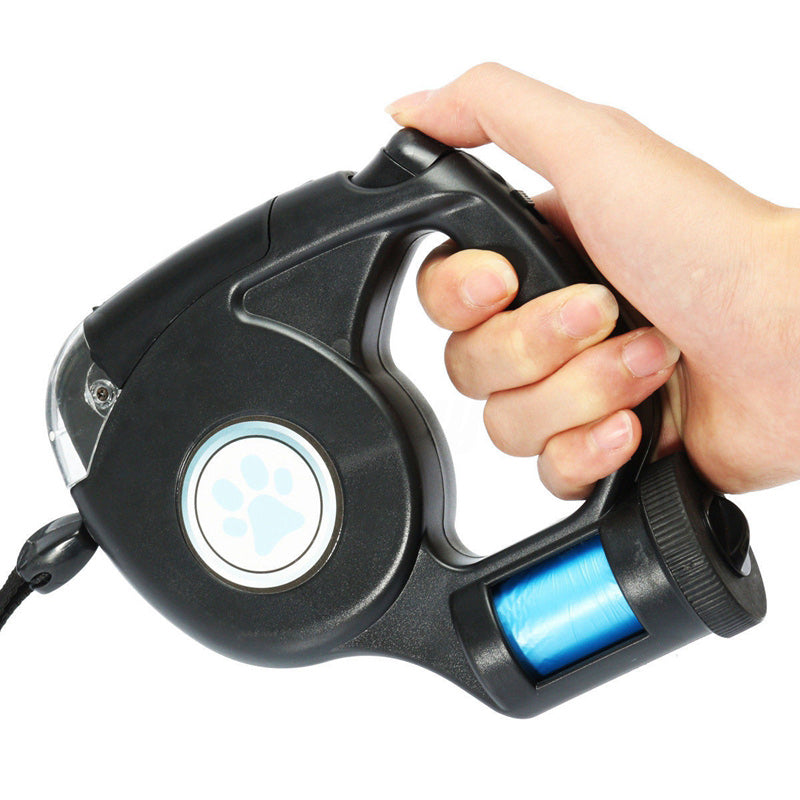 hand holding a retractable dog leash with flashlight on white background