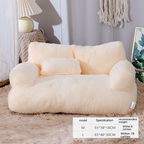 Fluffy white pet bed on a carpeted floor with dimensions and weight capacity label.