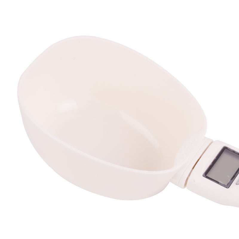 White handheld device with a digital display on a white background