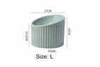 Green ceramic bowl with measurements on a white background