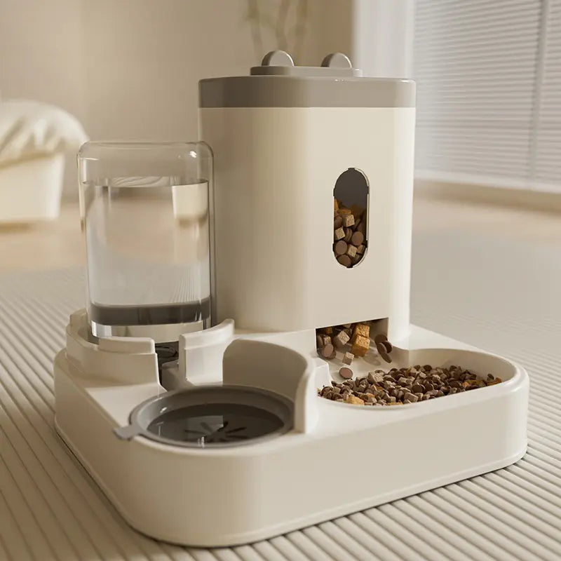 automatic gravity pet feeder and water dispenser with water bowl and food container on a light surface.