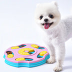 White dog standing next to a pink and blue puzzle toy on a white background