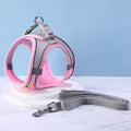 Pink and gray cat harness with a matching leash on a light blue background