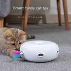 Cat playing with a smart funny cat toy on a carpeted floor.