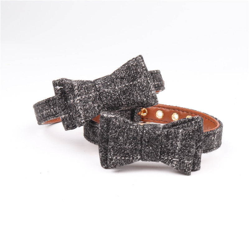 Two glittery black bracelets with brown leather accents on a white background