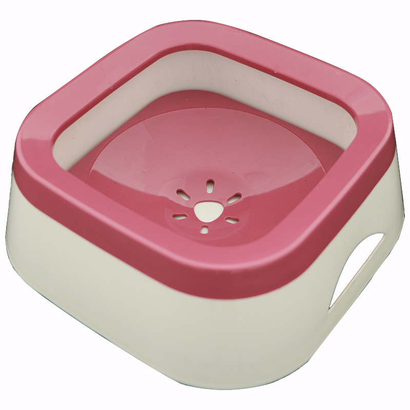 Pink and beige pet bowl on a white background