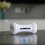 White electronic device with blue lights on a reflective surface