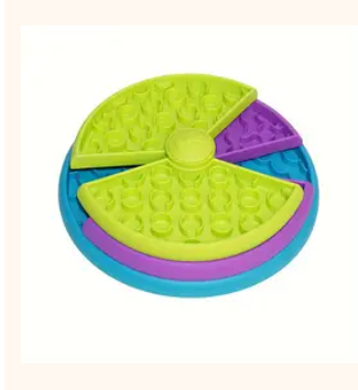 Colorful circular puzzle toy with green, blue, and purple sections on a white background