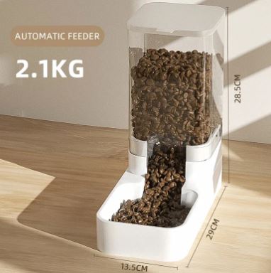 Automatic pet feeder with measured contents on a wooden floor