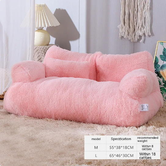 Pink fluffy pet bed on a carpeted floor with a lamp and decorative items in the background.