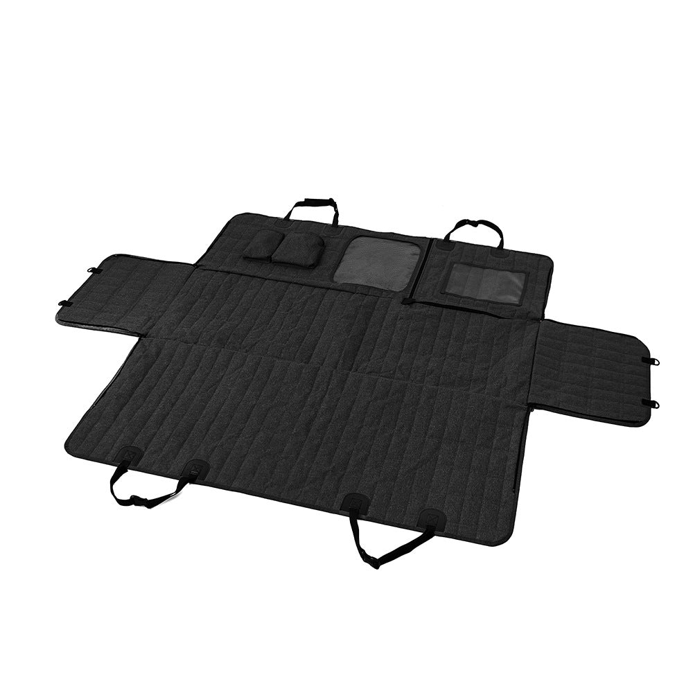 Black car mat with multiple compartments on a white background