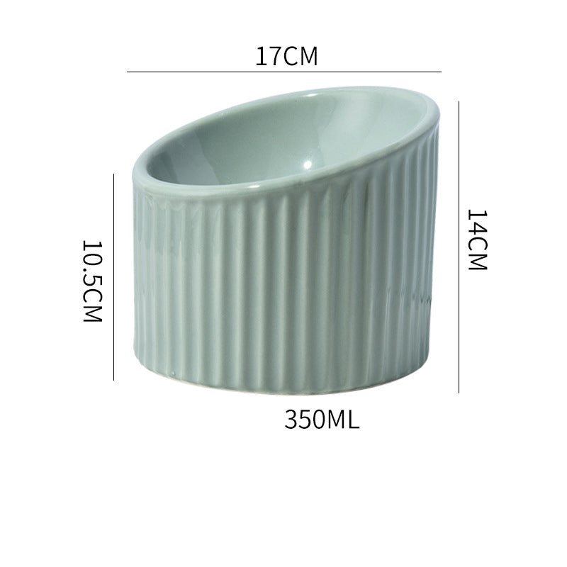 Green ceramic bowl with measurements on a white background