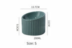 Green ribbed container with dimensions on a white background