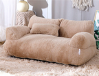 Beige fluffy sofa in a living room setting with soft textures and neutral colors.