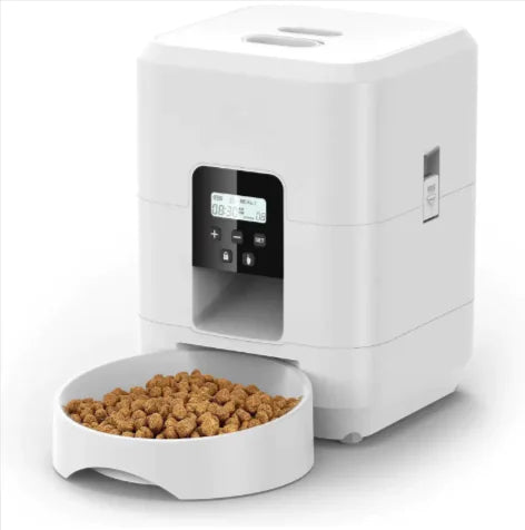 White pet food dispenser with a bowl of kibble on a white background