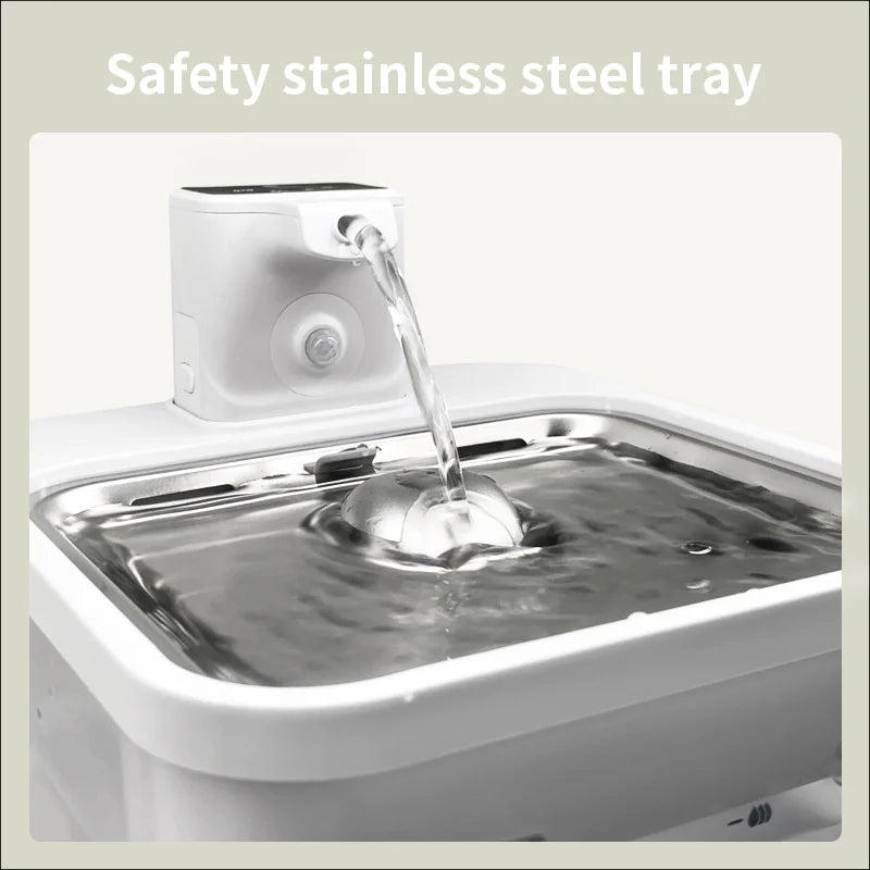 Stainless steel tray with water being poured into it, labeled 'Safety stainless steel tray'.