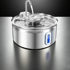 Stainless steel pet water fountain on a reflective surface with a dark background